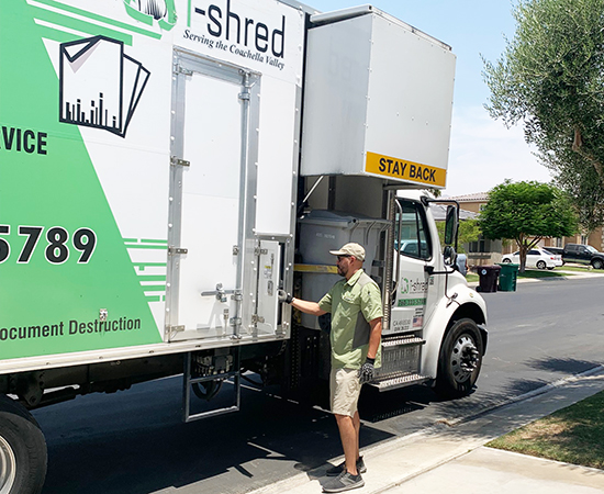 i-Shred mobile shredding truck driver shredding paper in mobile shredder