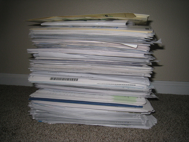 Fraud can be avoided, this stack of documents awaits safe disposal by document destruction company i-shred document destruction
